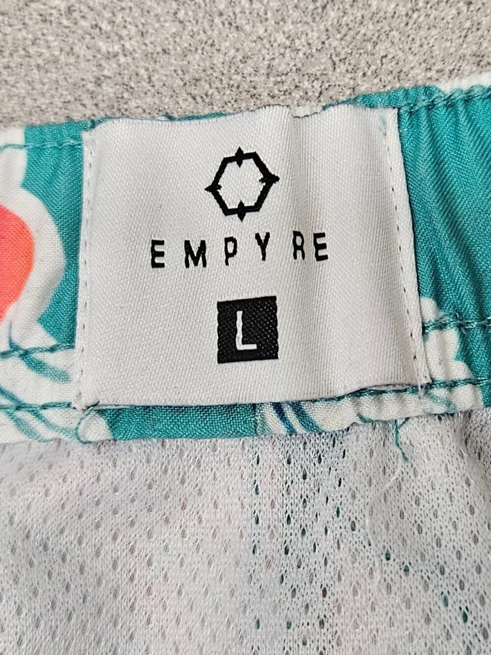 Spearmint Green Rose Swim Trunks by Empyre